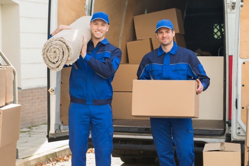 Removal team preparing boxes safely before a move