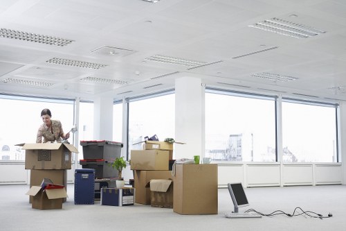A small removals team handling boxes and household items in Liverpool